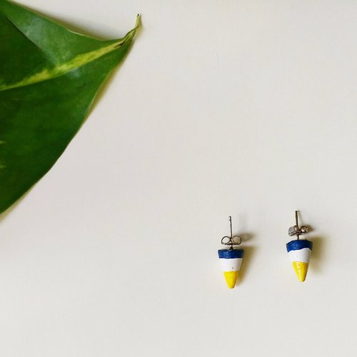 Had hands together to make a triangular pyramid earrings