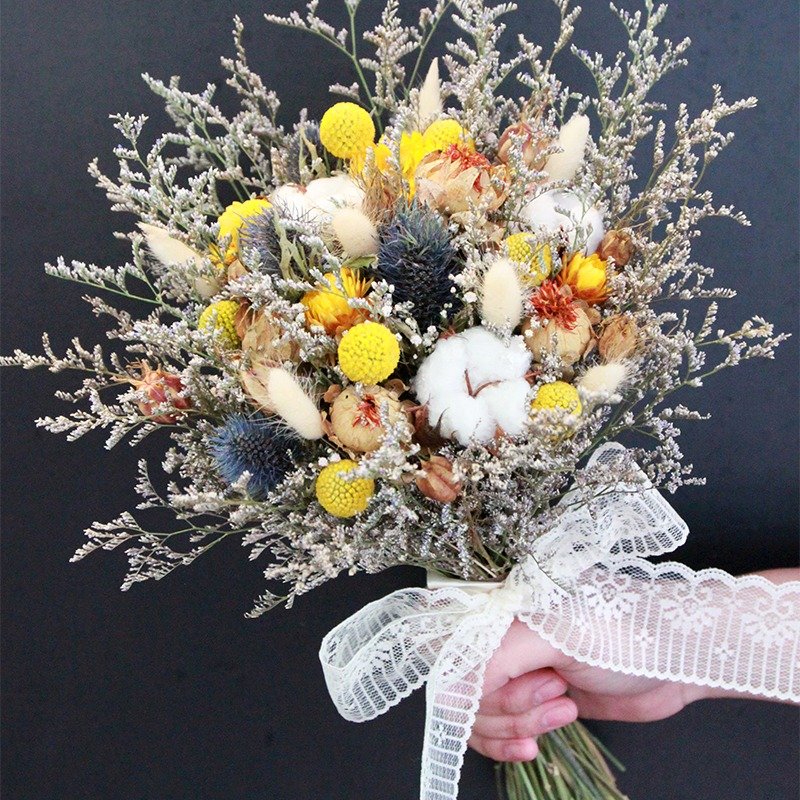 Flowers and flowers - yellow and blue lines in the long dry bouquet of dried bouquet wedding props