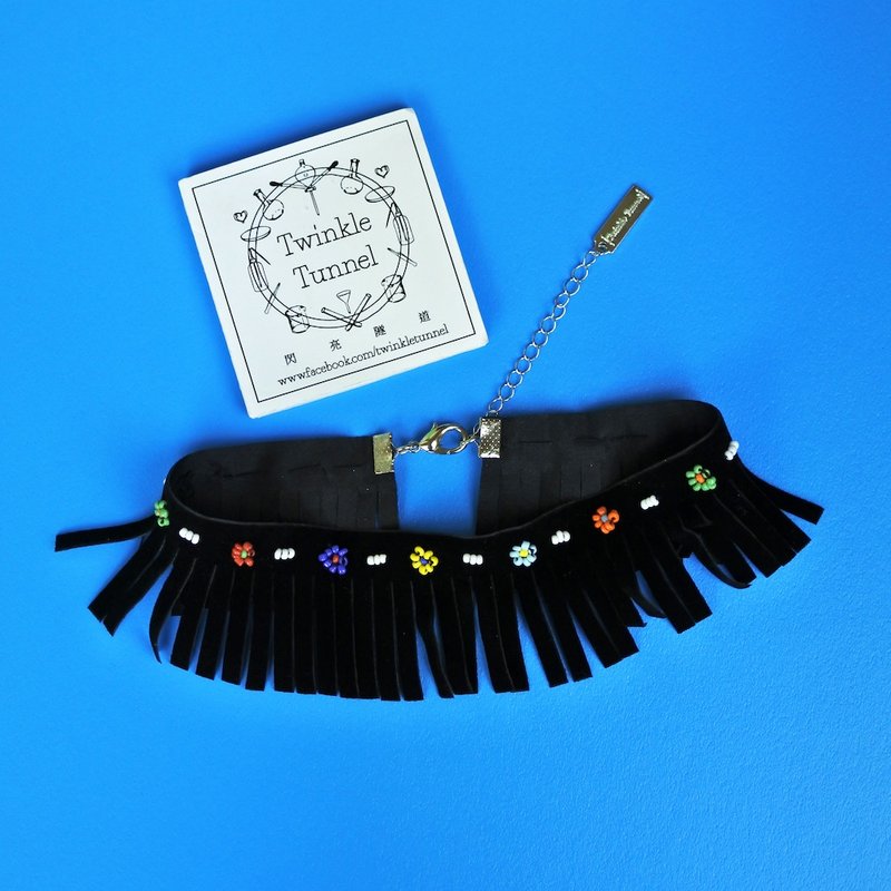Embroidered beads flocked tassel attached to the necklace