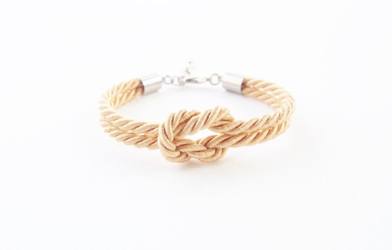 Light gold knot rope bracelet - สร้อยข้อมือ - วัสดุอื่นๆ สีทอง
