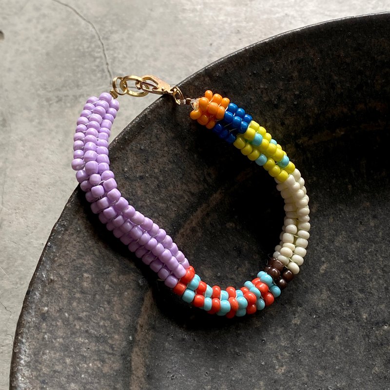 Wuer ethnic style four-strand colorful bead bracelet A - สร้อยข้อมือ - พลาสติก สีม่วง