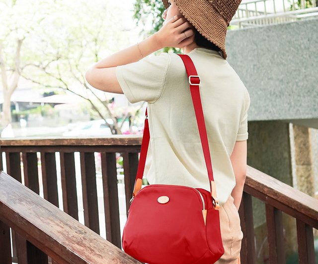 Round red crossbody on sale bag