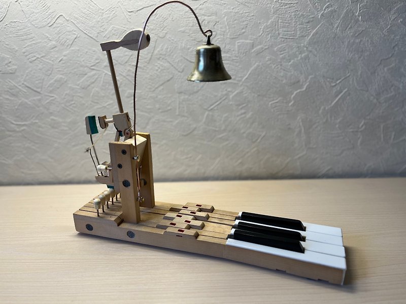 A table bell made of the keys and hammer of an old piano and an antique brass be - Other Furniture - Wood Brown