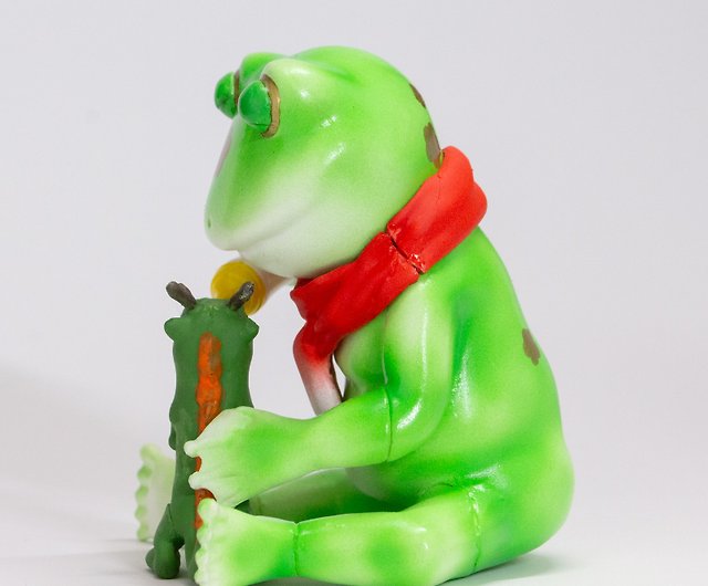 Frog feeding milk to a baby dragon of the Dragon zodiac sign