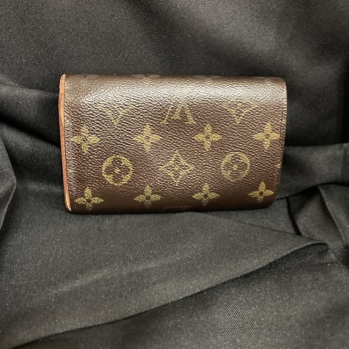 I found this Louis Vuitton Wallet at an estate sale a year ago. I tucked it  away not knowing if it was worth anything or what it could be used  for…thoughts? 