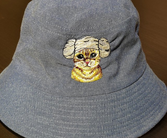 Fisher Hat (Gray) – a yellow object