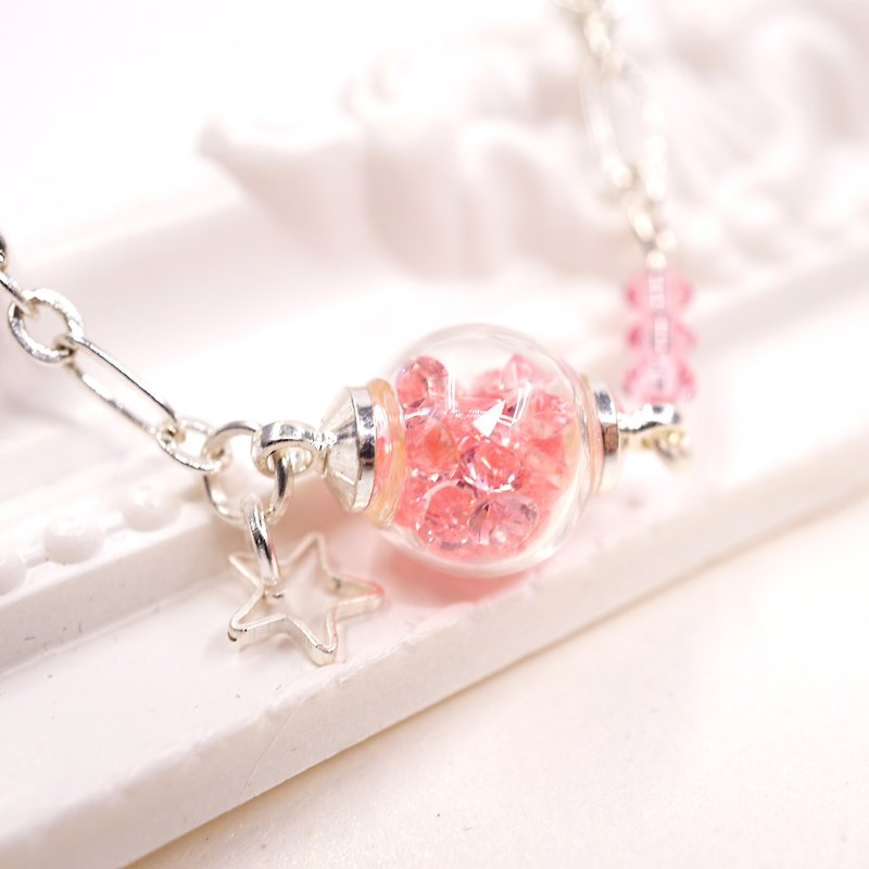 A Handmade pink glass ball bracelet