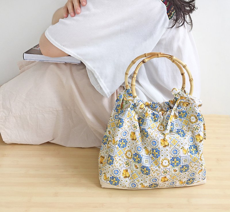 Mediterranean style handbag bamboo circle lemon tile - กระเป๋าถือ - ผ้าฝ้าย/ผ้าลินิน สีเหลือง