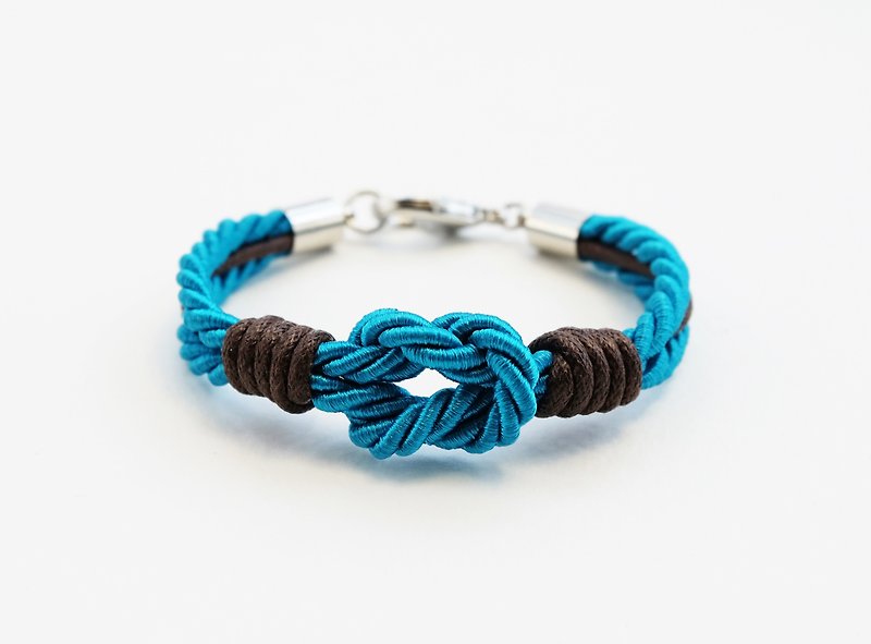 Teal blue tie the knot bracelet with dark brown waxed cotton cord - สร้อยข้อมือ - วัสดุอื่นๆ สีน้ำเงิน