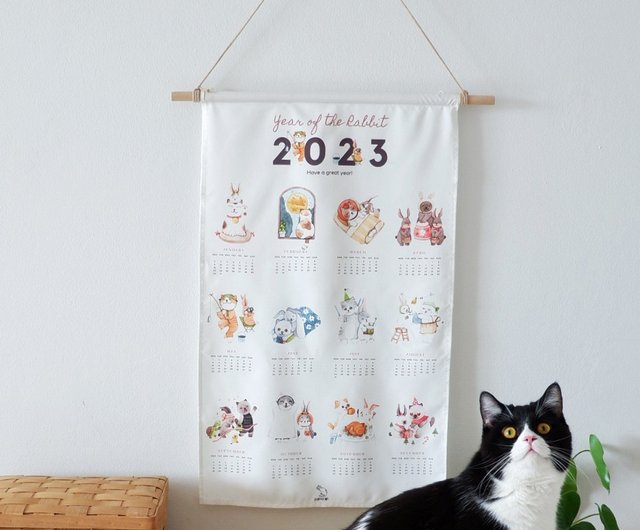 うさぎとねこをテーマに水彩絵の具でプリントした23年卯年を迎えるファブリックカレンダーです ショップ Purrcraft ウォールデコ 壁紙 Pinkoi