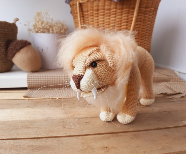 スカーフを巻いたぬいぐるみライオンのグリフェンドール。ハリー