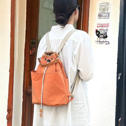 NAPSAC オレンジ KONBU 撥水加工ナイロン素材 巾着リュック