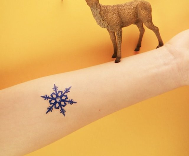 blue snowflake tattoo
