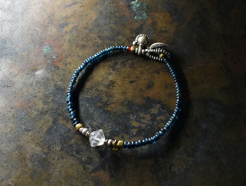 A delicate bracelet made of Indigo blue mix antique beads, abacus-shaped ancient crystal, old Indian Silver charm, old Chin Silver and Orissa brass. - Bracelets - Glass Blue