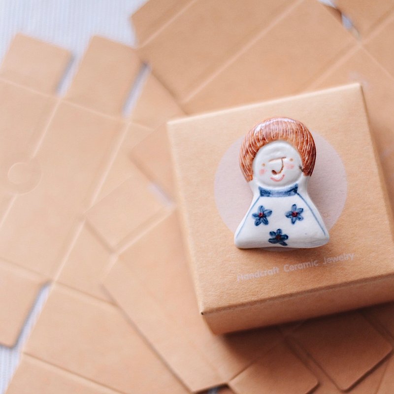 Receive the production of souvenir brooches.